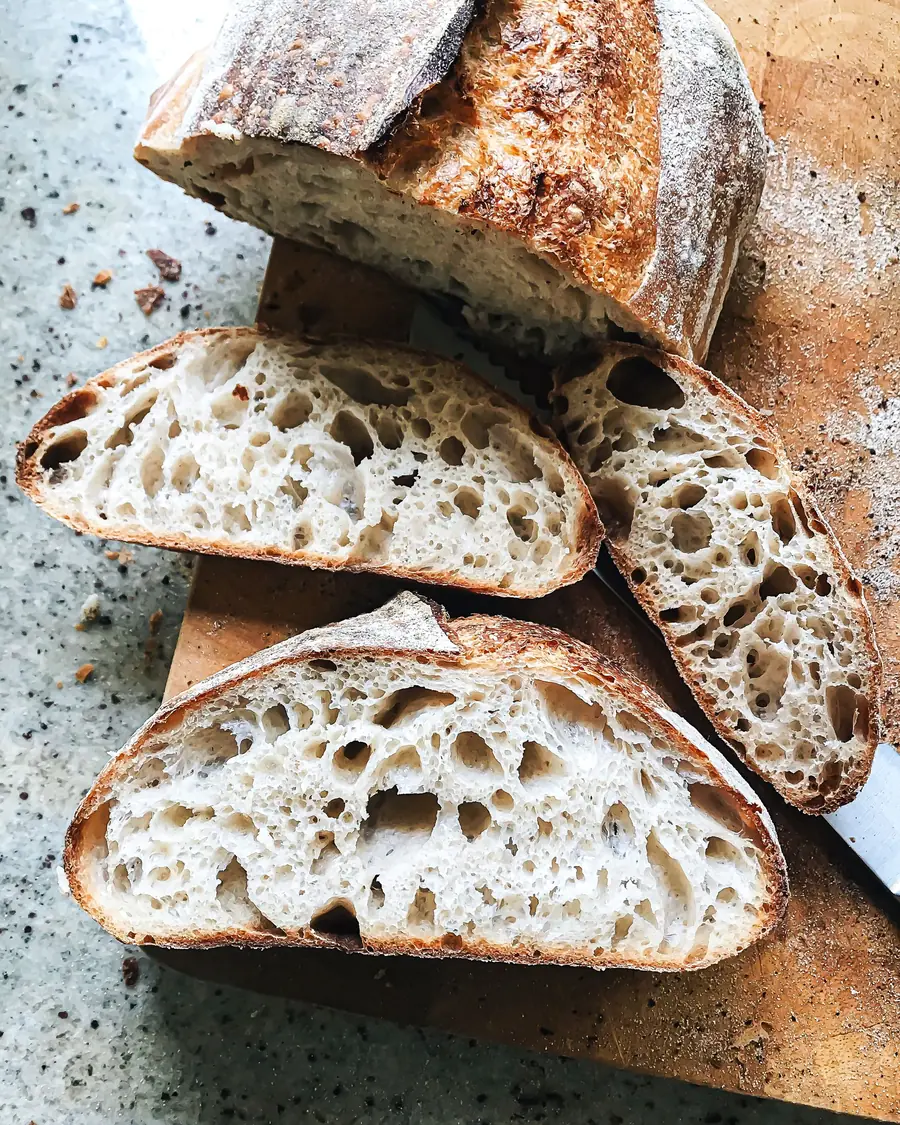 Sliced sourdough showing an open, airy crumb